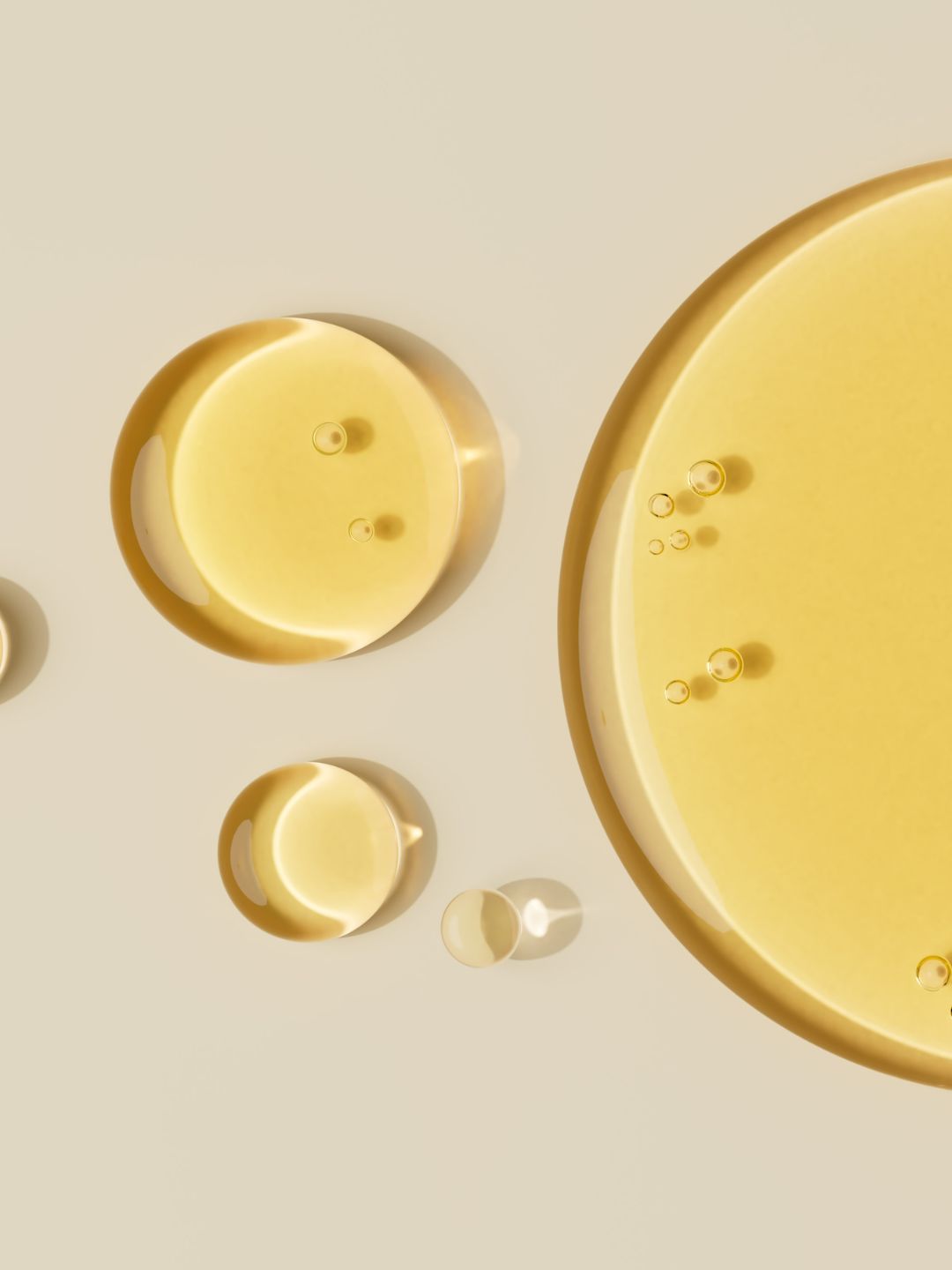 Golden droplets of gentle cleansing oil that lift make-up without soap, in KALME's water-free cream cleanser for sensitive skin