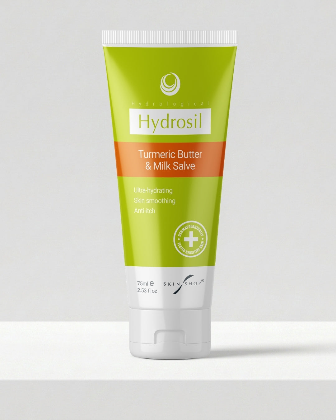 A 75ml tube of Hydrosil Turmeric Butter & Donkey Milk Salve standing on a plain pale grey background