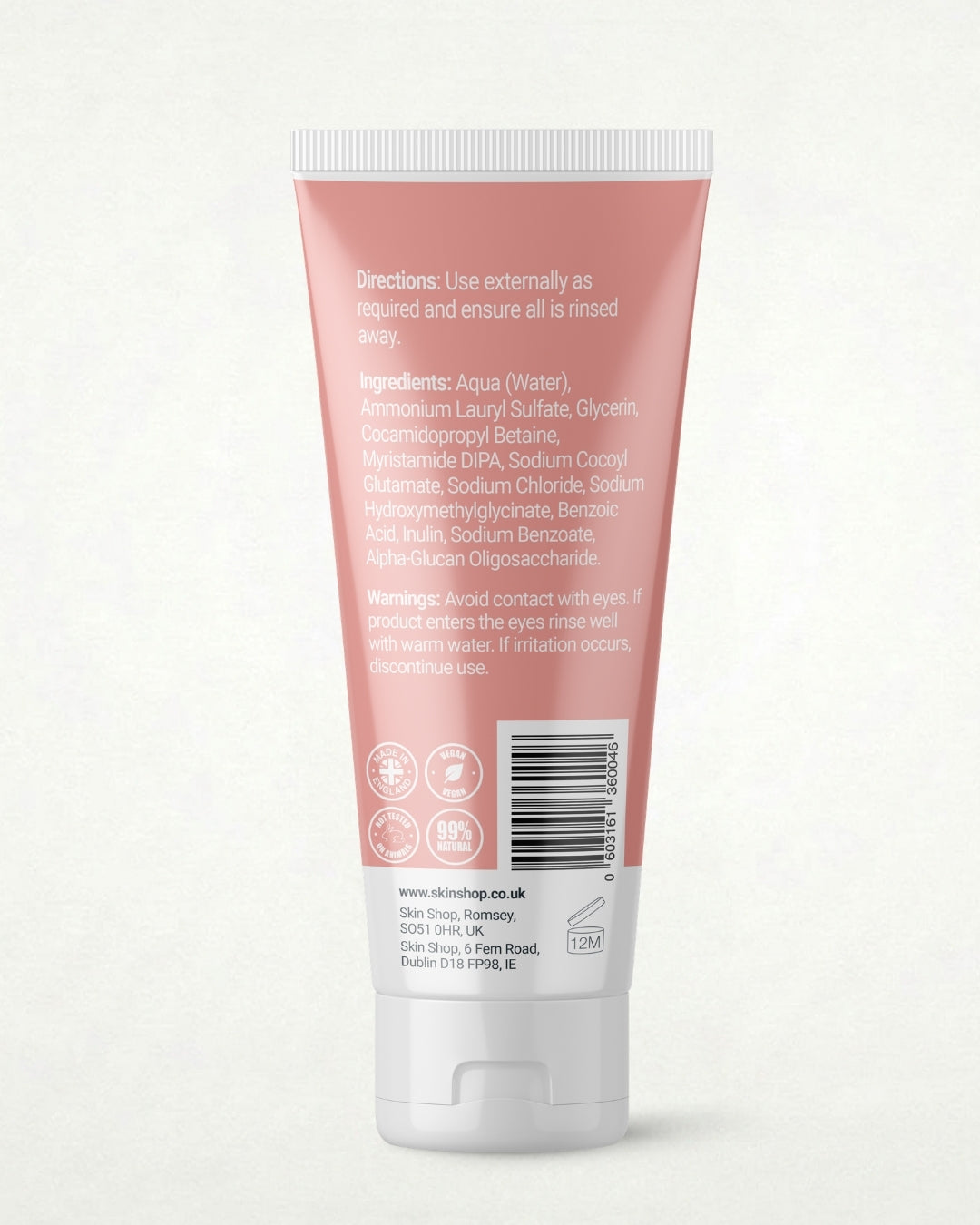 The back of a pink squeeze tube of In2mate Natural Moisturiser, showing the directions, ingredients, warnings, made in England, vegan, 99% natural and barcode on a light off-white background