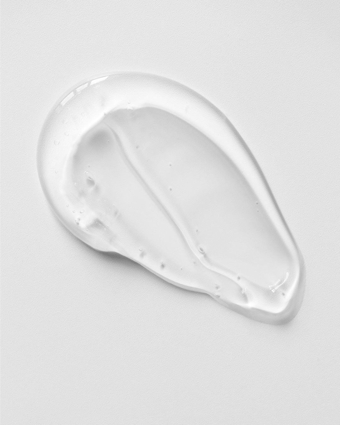 A swatch of Hydrosil Dry Eye Gel showing its clear, light, smooth gel texture on a pale background