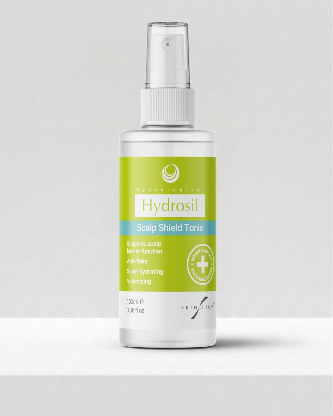 A 100ml white spray bottle of Hydrosil Scalp Shield Tonic, with its green and blue label and fine-mist pump, the leave-in scalp tonic for dry, itchy scalps.